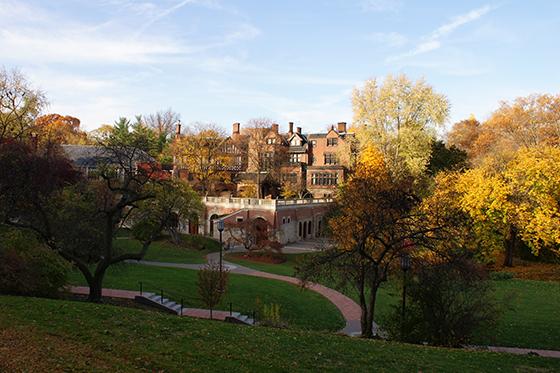 Photo of Mellon Hall on Chatham University, surrounded by green academic quads and colorful fall foliage.